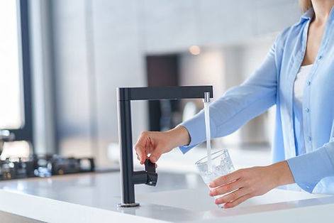 lady filling a glass of water
