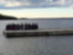 people sitting together on a dock