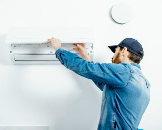 Maintenance engineer checking technical data of heating system