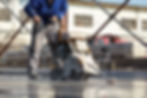 Man making use of concrete cutting machine