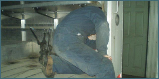 Employee working on truck.