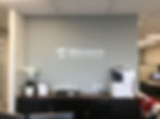 Office wall with their brand name sticker