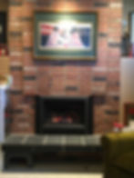 Fireplace below a Coca-Cola painting