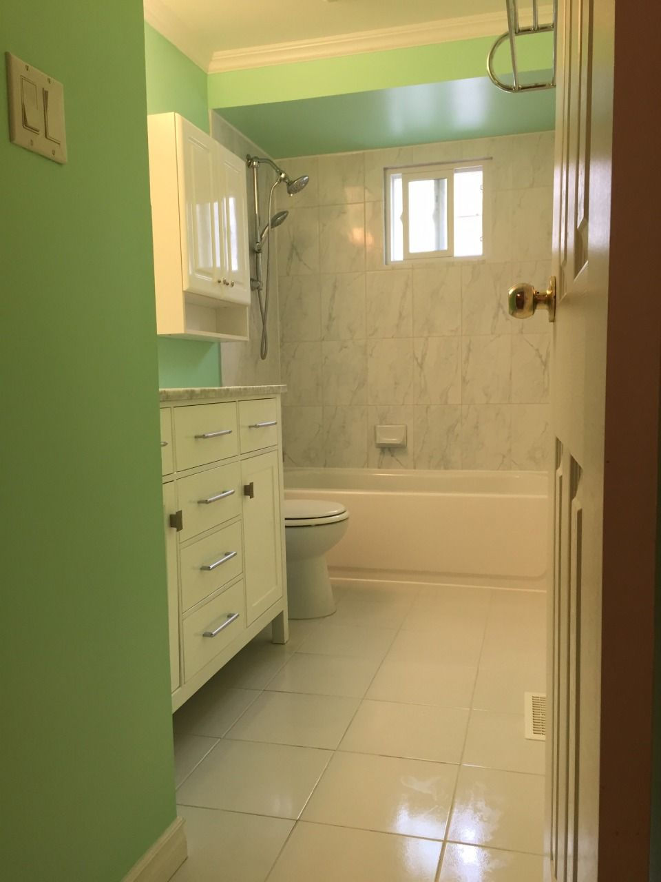 green and white themed bathroom