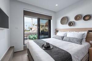 Indulge in a luxurious vacation at Taf Villas, a premium beach resort on Greece's beautiful Kos Island, where the 3-bedroom villa, with a stylishly appointed bedroom, provides upscale accommodation and access to a tranquil pool, creating an ideal retreat for a memorable and relaxing escape.