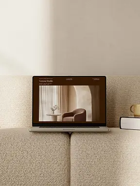 Lifestyle laptop mockup featuring an interior design presentation in neutral colours.