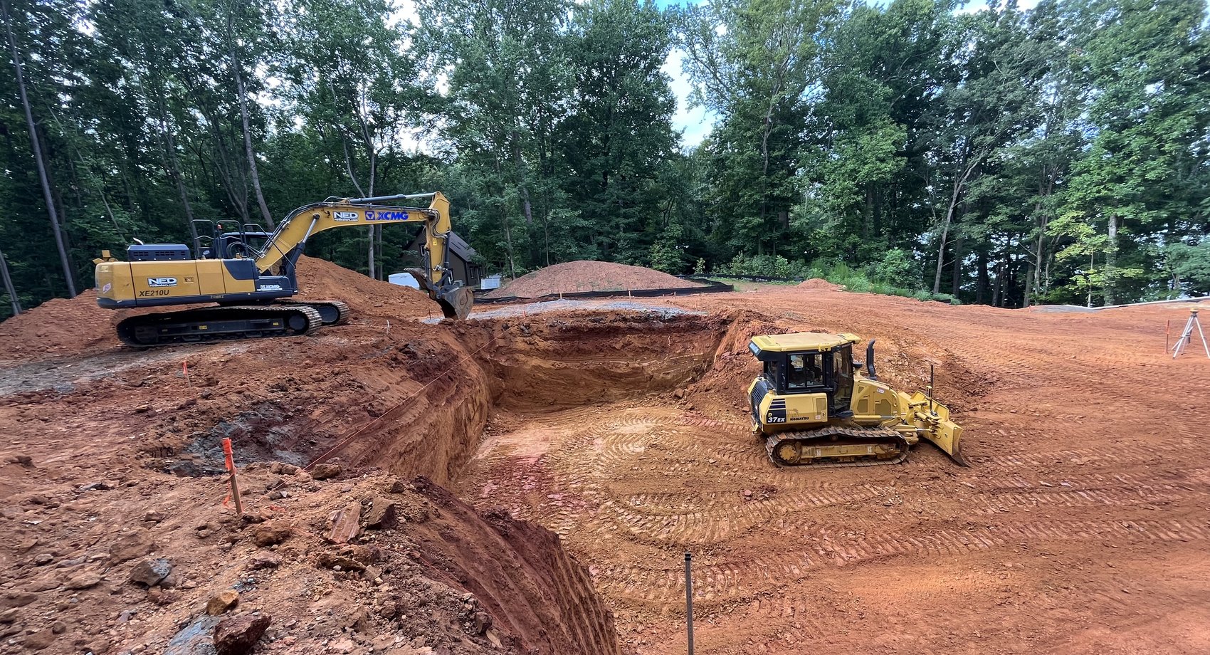 McCrone Excavating crew operating excavator and dozer on a job site