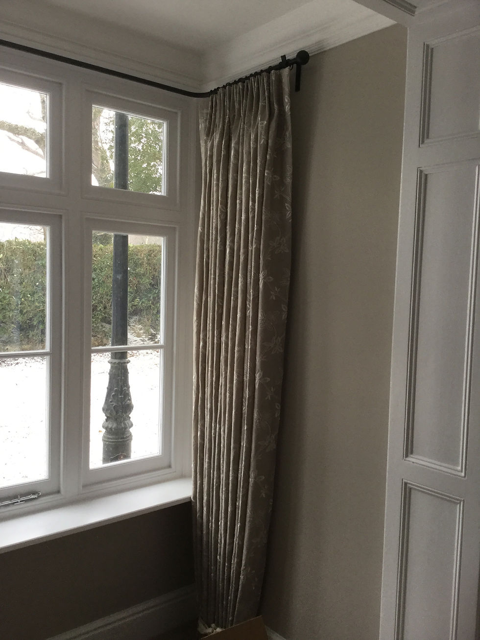 Wrought iron pole made for bay window.