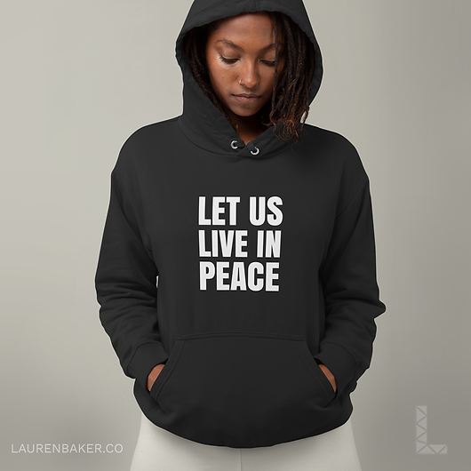 hoodie-black-mockup-of-a-woman-looking-down-let-us-live-in-peace.png