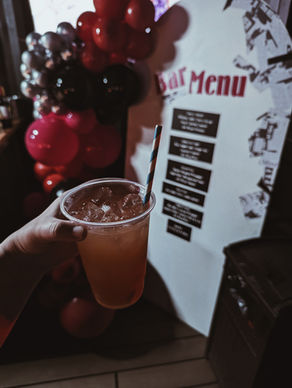 Cocktails, balloon decor, and nightlife aesthetic make a Buffalo bachelorette complete.