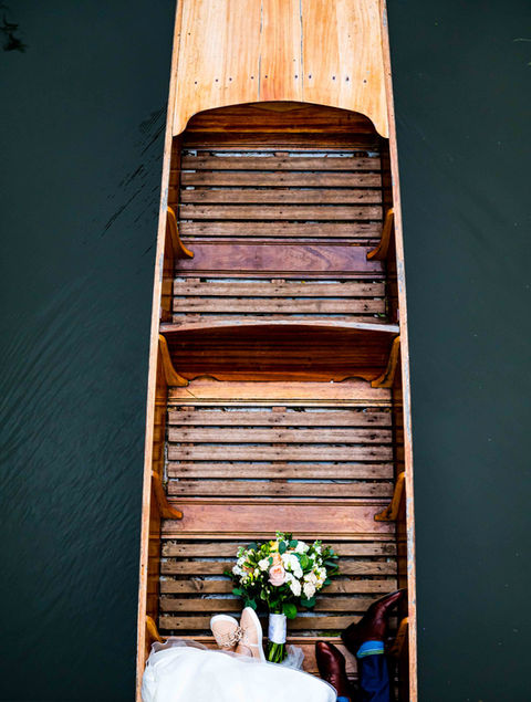 Bride and groom being punted down river to The Cherwell Boathouse 