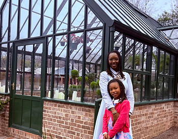 The Huntsville Gardener & her daughter at a greenhouse.