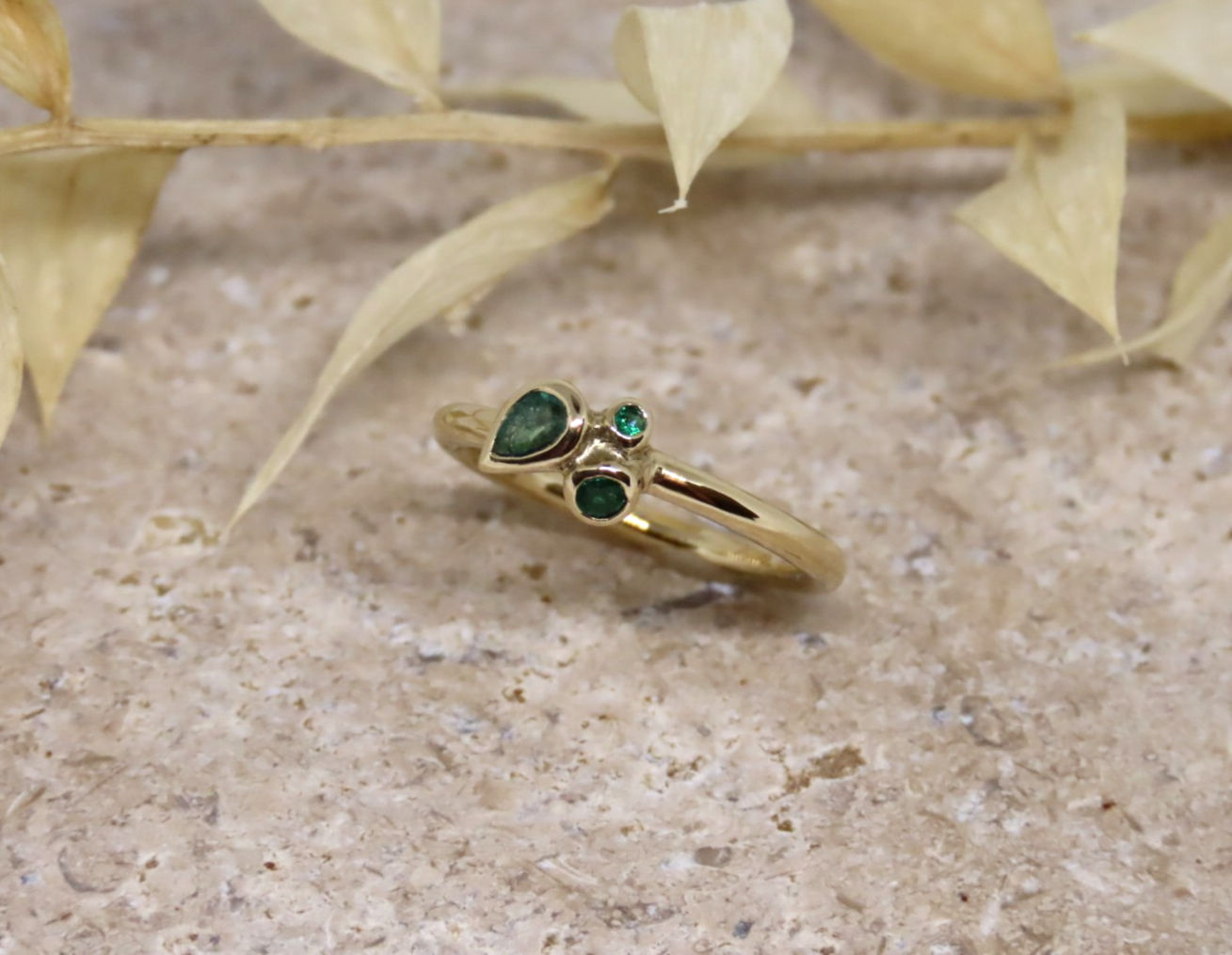 Pear emerald trio ring
