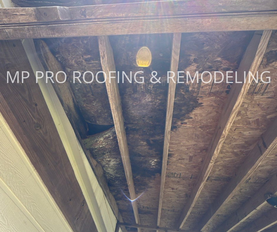 Severe deterioration and water damage are visible on the roof decking.
The wood panels show significant rot and moisture exposure, compromising the structural integrity of the roofing system