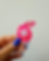 pink tamagotchi sticker with "feed me" in a speech bubble