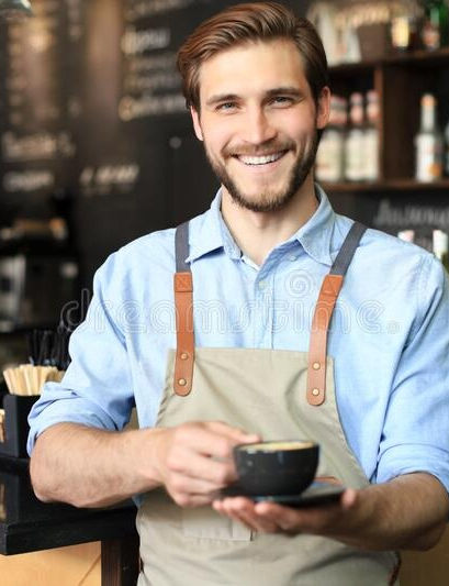 handsome-barista-offering-cup-coffee-to-camera-shop-187711925_edited.jpg