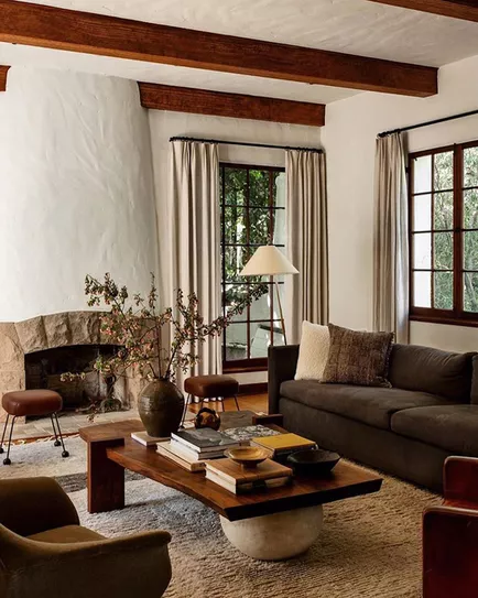 A spanish style living room with a rug