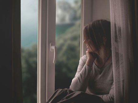 woman sitting at window
