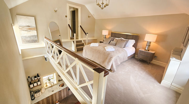 Loft-style sleeping area inside private cottage in County Meath