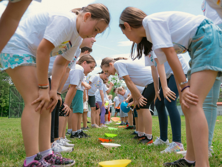 Kids playing games during school holiday programs and vacation care
