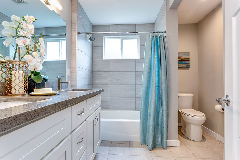 Modern bathroom remodel with new fixtures, lighting, and tile upgrades