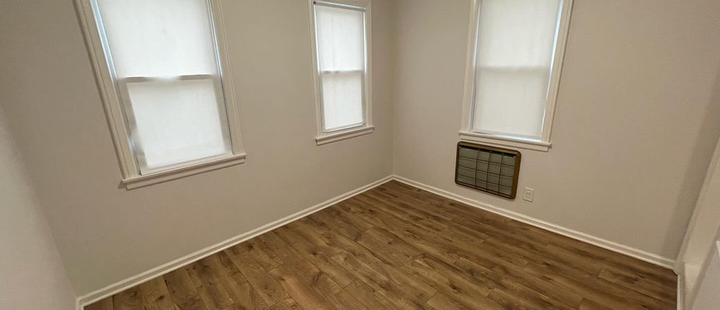 Bucktown room painted in beige with white trim for a warm, classic interior finish