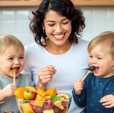 nanny raising happy toddlers who are eating fruit