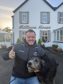 Stephen McPhilemy with Irish wolfhound at Dingle hotel