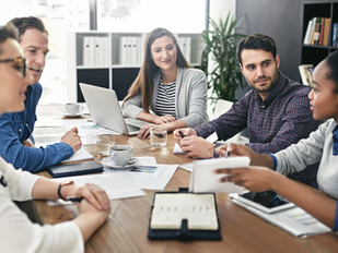 Professionals sitting around a table.