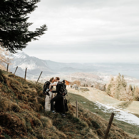 a married couple hiking at their wedding in interlaken, switzerland