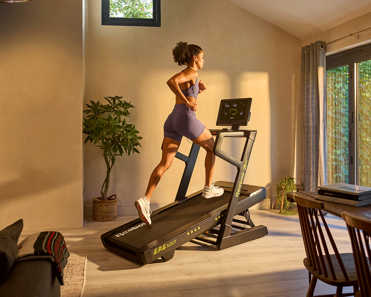 Women running on the Reebok ERS 520T Treadmill at an incline