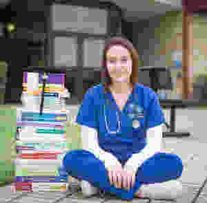 Nursing student with a chronic illness sits quietly