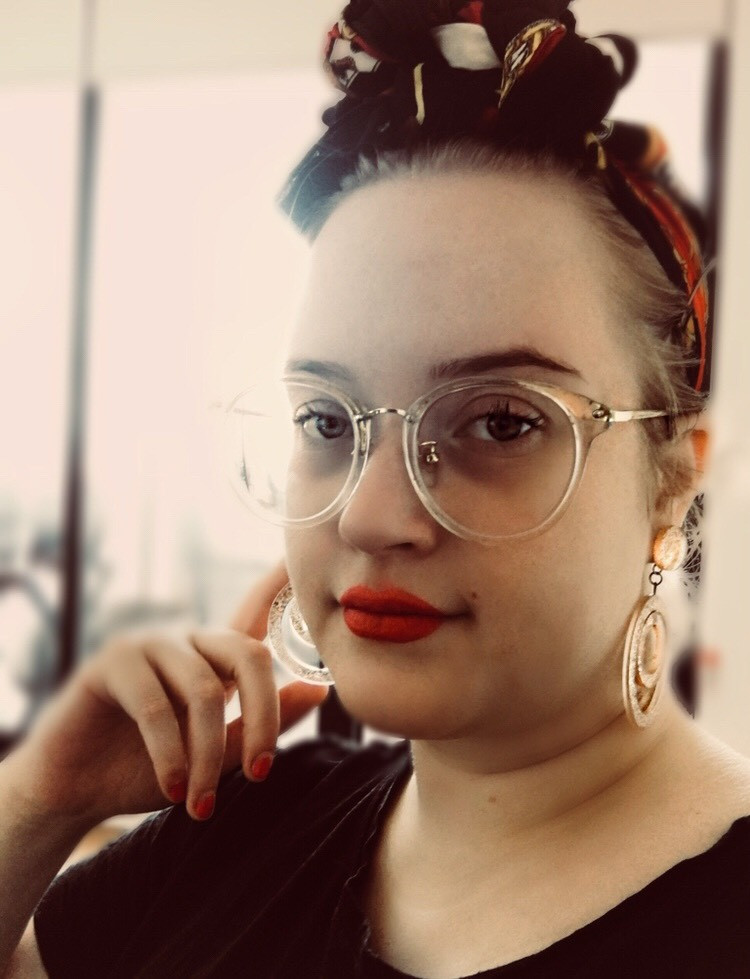 girl with glasses suffering from endometriosis