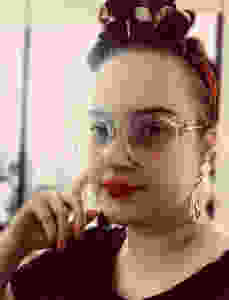 girl with glasses suffering from endometriosis