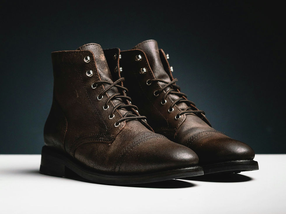 Brown leather ankle boots with a low stacked heel