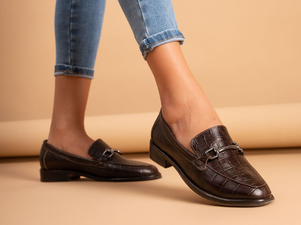 Brown leather bit loafers with cuffed jeans