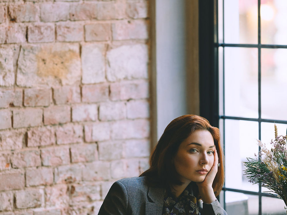 Woman in a grey tailored blazer