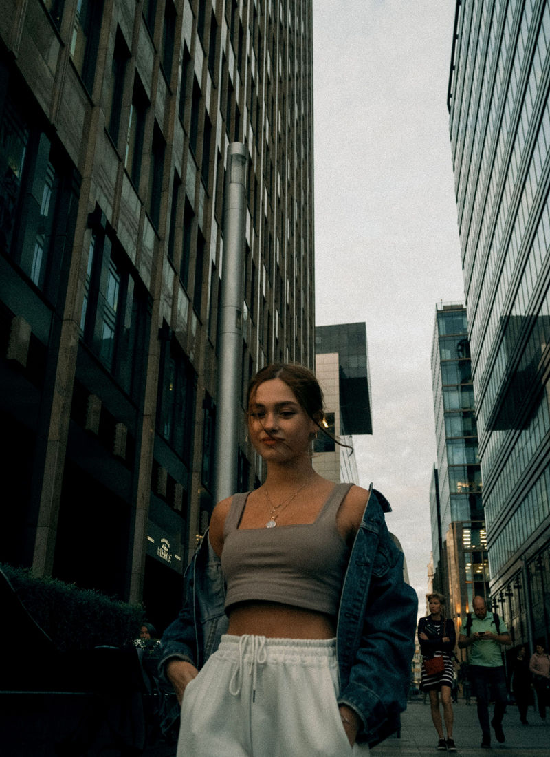 Cropped denim jacket worn open over a high waist