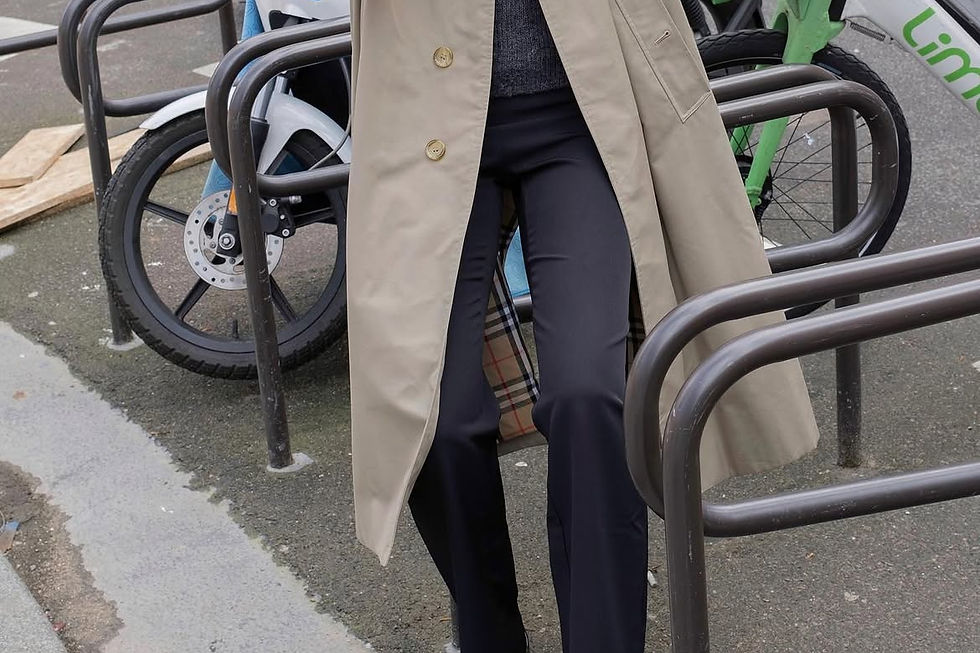Patent leather Mary Jane flats with black trousers and a trench