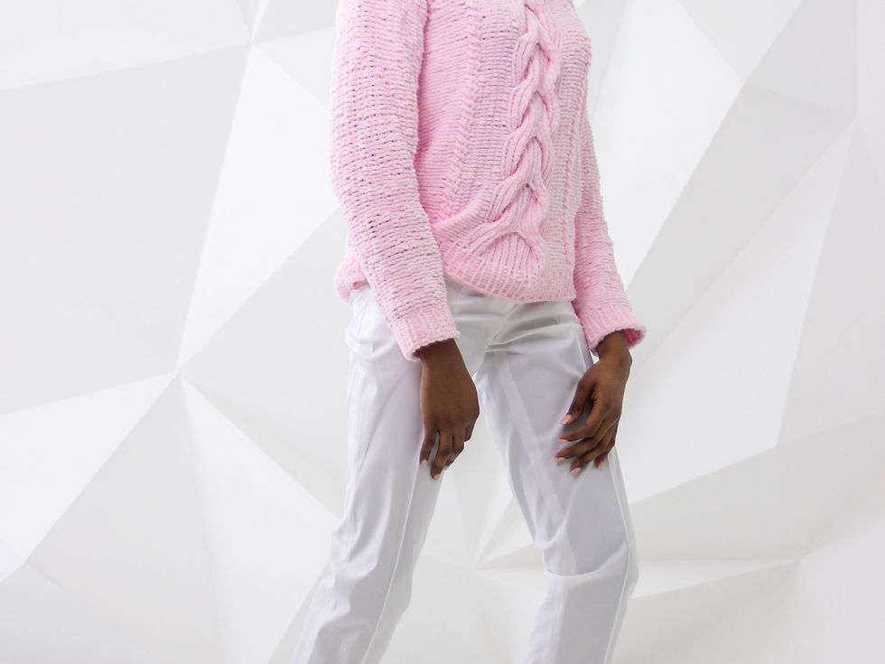 Woman in a knit sweater and cropped trousers