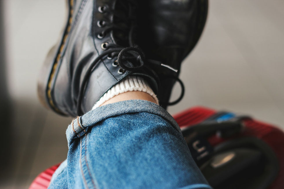 Black lace-up boots styled with jeans