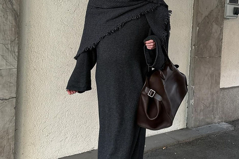 Charcoal knit midi dress with black ankle boots and a wrap