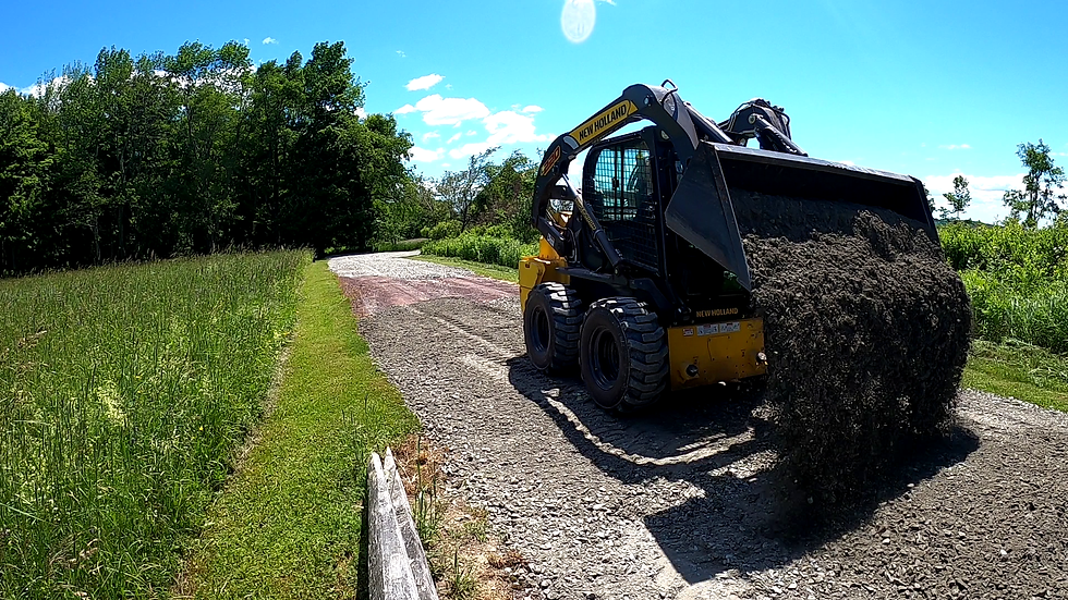 spreading stone skidsteer