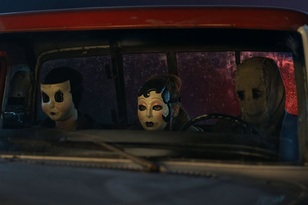 Dollface, Pin-Up Girl, and Scarecrow sit in a truck