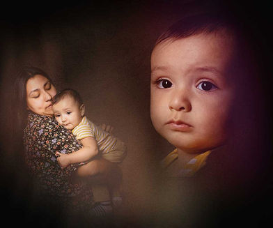 Family portrait of a parent and her child lovingly, together in a photography studio