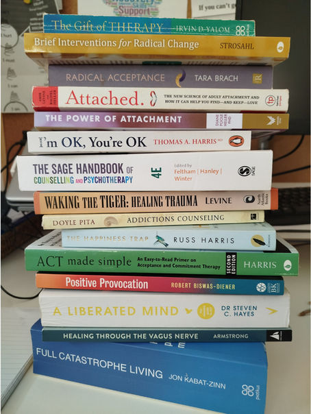 A stack of counselling related text books