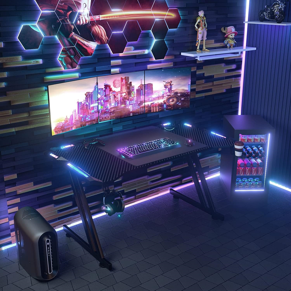 Dlongone Gaming Desk set-up with three monitors and strip lights