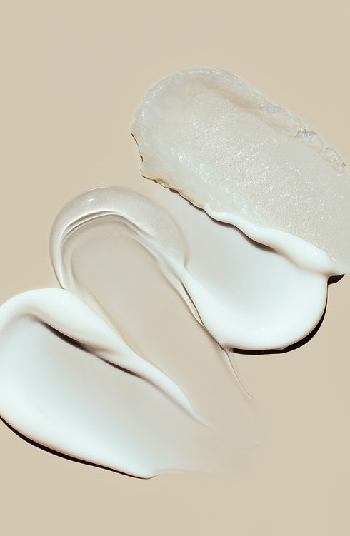cosmetic-smears-of-creamy-texture-on-a-beige-backg-2026-03-19-22-08-53-utc.jpg