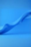 blue fabric 3d video that is flowing on a blue background from right to left.jpg