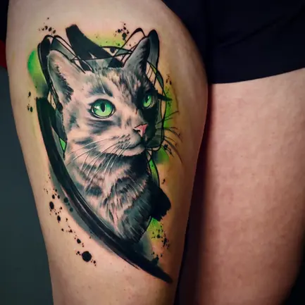 Tavarismus style black, grey and green realistic cat bust tattoo with abstract brushstrokes on the thigh by Tiago Tavares Tattoo.